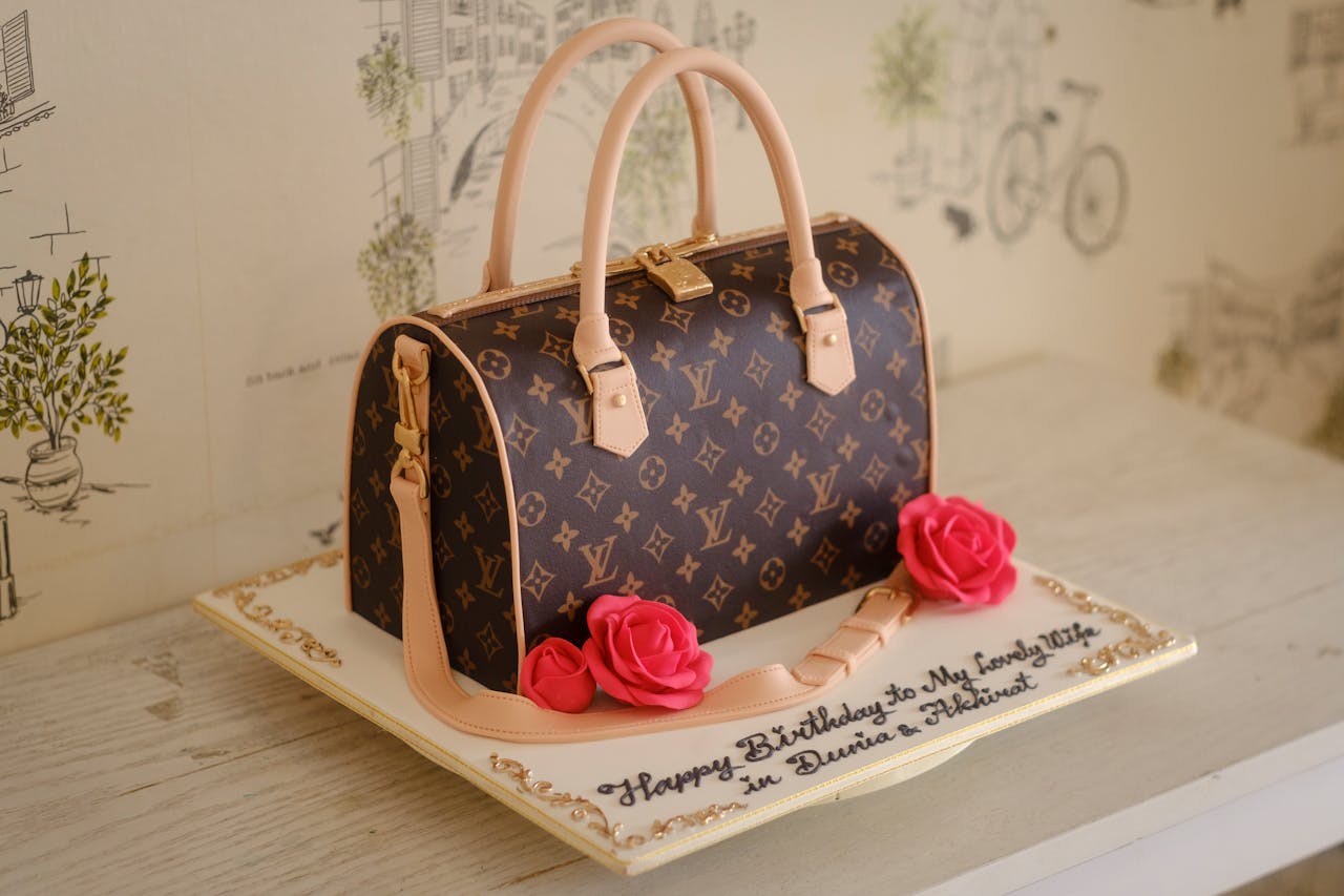 Elegant cake designed like a handbag with decorative roses for a special celebration.